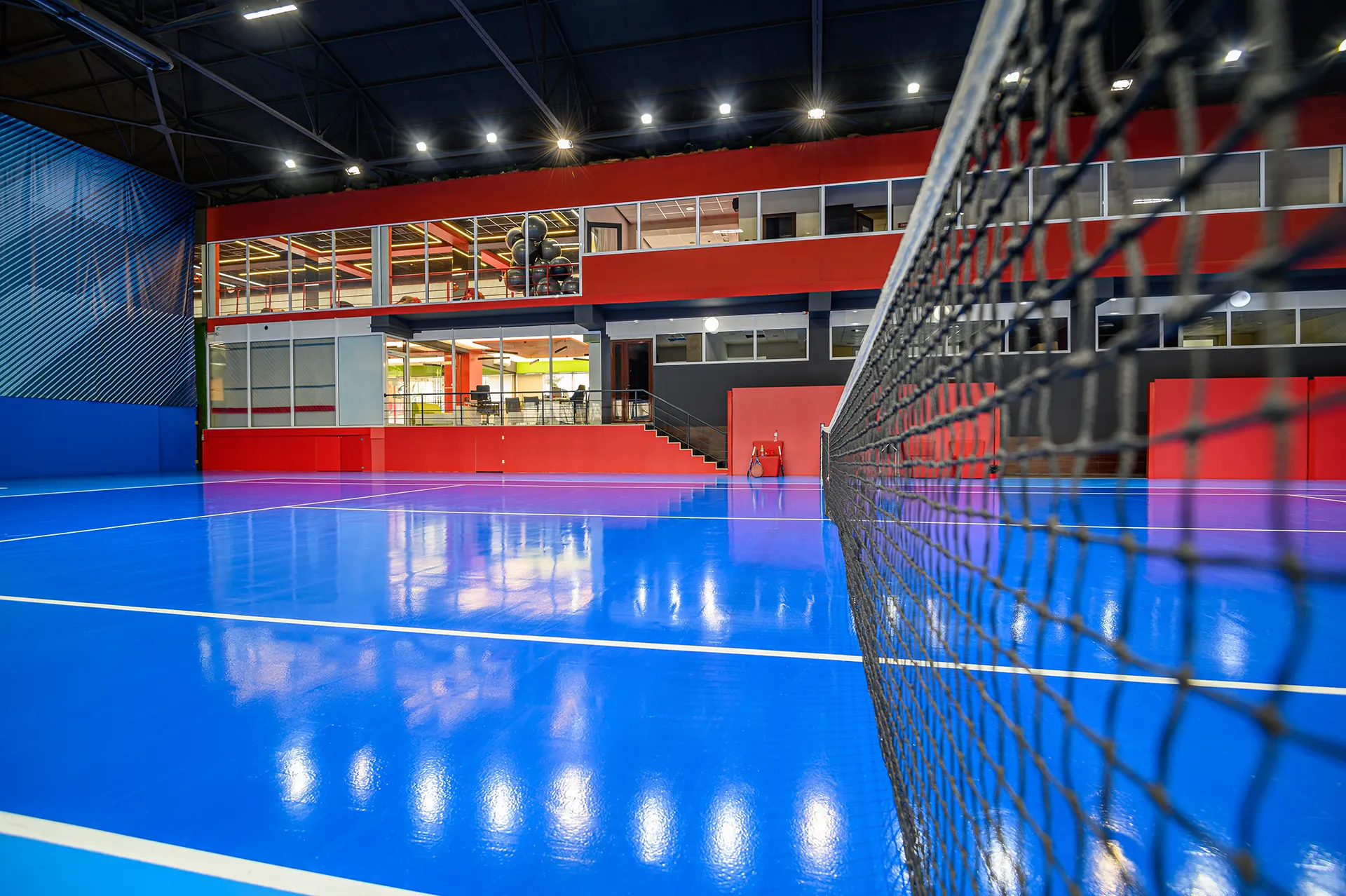 EN-14904 6 EN-14904 blue colored empty indoor tennis court 2024 10 18 03 24 33 utc